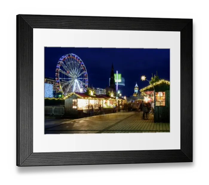 Framed Print : Scotland, Edinburgh, Princes Street Christmas Market. A traditional European Christmas Market located along Princes Street with the Scotts Monument and Balmoral Clock Tower in view