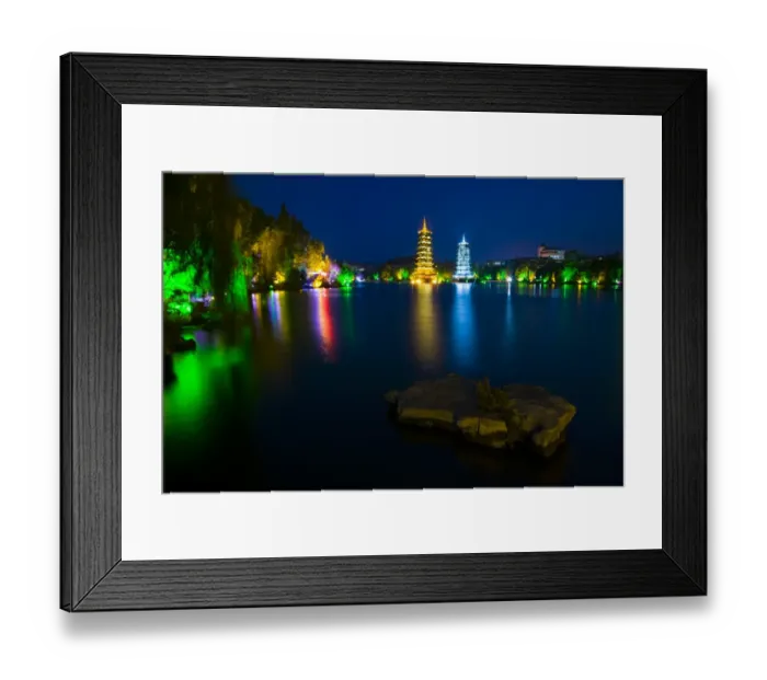 Framed Print : China, Guangxi Zhuang Autonomous Region, Guilin City. Illuminated Pagodas at dusk