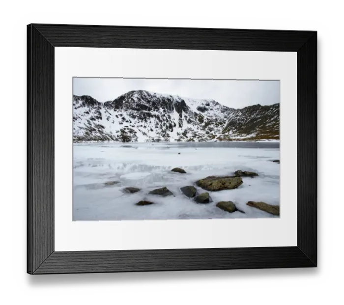 Framed Print : England, Cumbria, Lake District National Park. Rocks and the ice covered expanse of Red Tarn