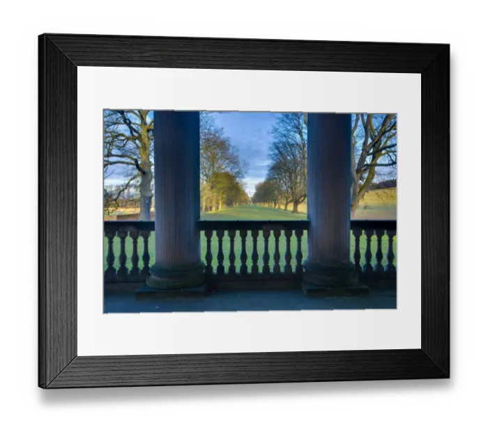 Framed Print : England, Tyne and Wear, Gibside. Looking through the stone pillars of the Gibside Chapel towards the half mile, Oak tree lined walk heading to the Column Framed Print : England, Tyne and Wear, Gibside. Looking through the stone pillars of the Gibside Chapel towards the half mile, Oak tree lined walk heading to the Column