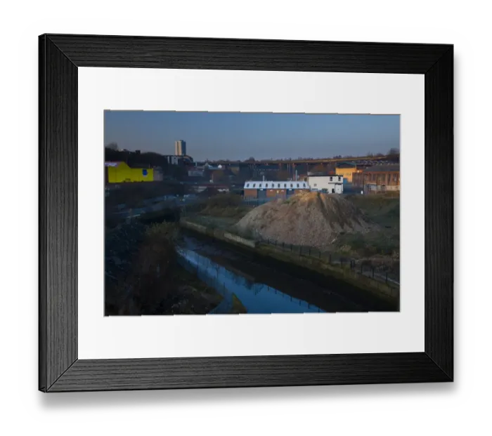 Framed Print : England, Tyne and Wear, Newcastle Upon Tyne. The Ouseburn running through a disappearing industrial landscape. The 800 metre long Byker Viaduct can be seen in