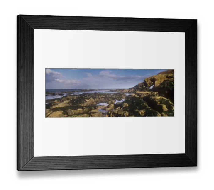 Framed Print : England, Tyne and Wear, Cullercoats. Rocky coastline and natural arch located on the south side of Cullercoats Bay found along the North Framed Print : England, Tyne and Wear, Cullercoats. Rocky coastline and natural arch located on the south side of Cullercoats Bay found along the North