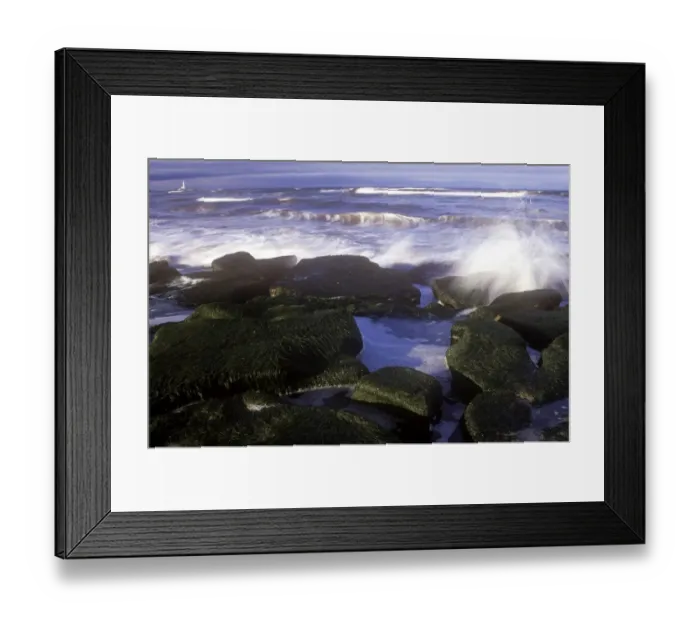 Framed Print : Crashing North Sea waves engulf the rock coastline of the Whitley Bay seafront