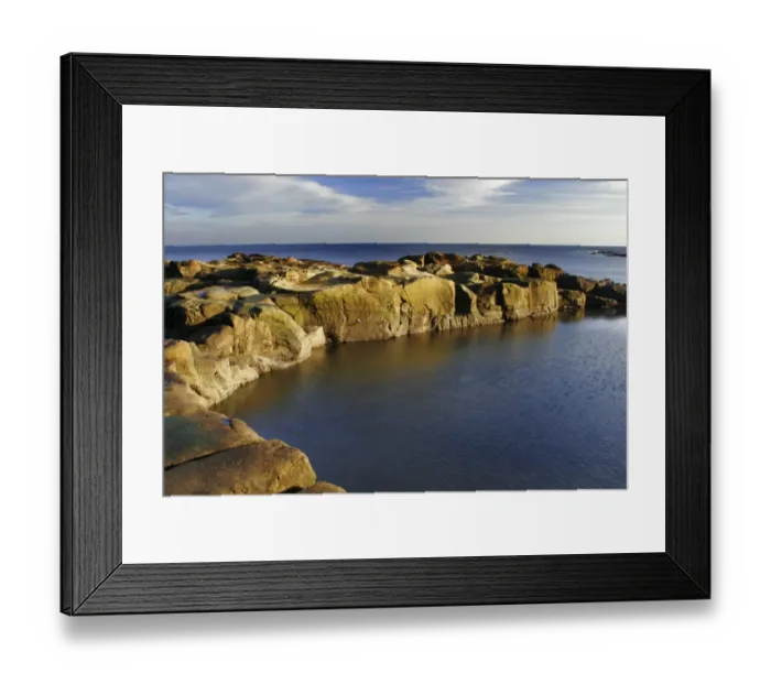 Framed Print : A swimming and bathing pool cut into the rocky coastline of the North Sea in North Tyneside