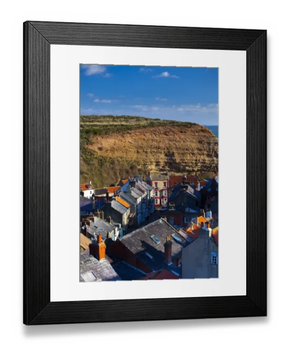 Framed Print : England, North Yorkshire, Staithes. View looking down on the roofs and chimney pots of the old town of Staithes, located within the North York Moors