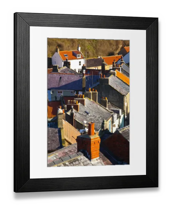 Framed Print : England, North Yorkshire, Staithes. View looking down on the roofs and chimney pots of the old town of Staithes, located within the North York Moors Framed Print : England, North Yorkshire, Staithes. View looking down on the roofs and chimney pots of the old town of Staithes, located within the North York Moors