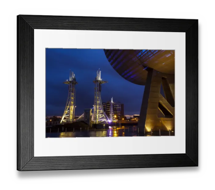 Framed Print : England, Greater Manchester, Salford Quays. The Lowry Centre at dusk looking towards the Lowry Bridge, located on the Salford Quays in the city of Salford near Manchester