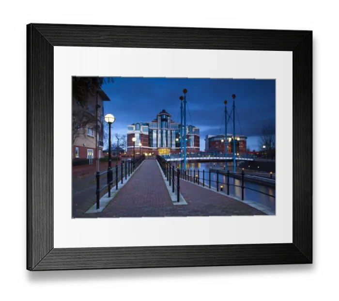 Framed Print : England, Greater Manchester, Salford Quays. Victoria Harbour building beyond Mariners Canal footbridge on the Manchester Ship Canal located