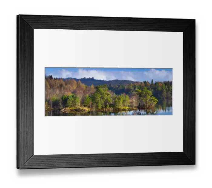 Framed Print : England, Cumbria, Lake District National Park. Mix of deciduous and evergreen trees surrounding the waters edge of Tarn Hows, a popular tourist destination once owned by Beatrix Potter and almost a totally