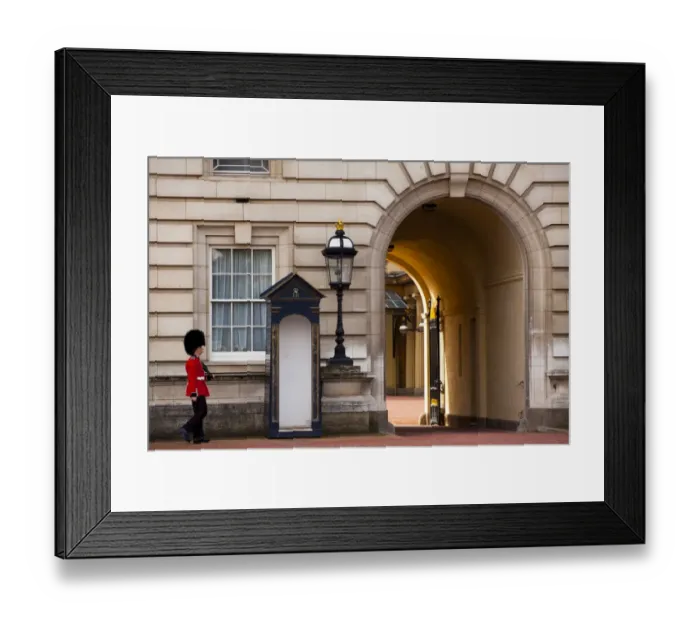 Framed Print : England, Greater London, City of Westminster. Queens Guard walking towards archway outside Buckingham