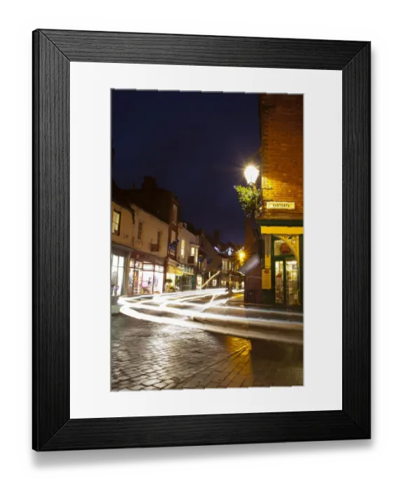 Framed Print : England, Lincolnshire, Lincoln. Traffic at dusk along Eastgate in the historic UK city of Lincoln Framed Print : England, Lincolnshire, Lincoln. Traffic at dusk along Eastgate in the historic UK city of Lincoln