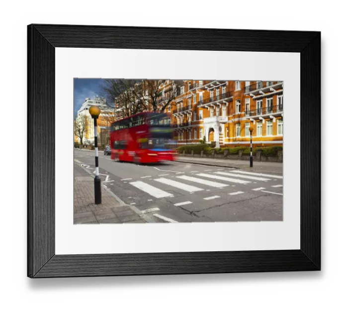 Framed Print : England, London, Abbey Road. A red London bus approaches the famous pedestrian crossing at Abbey Road, made famous by the cover of the Beatles album of