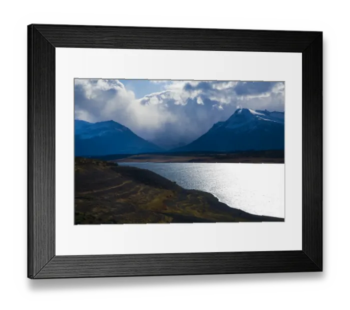 Framed Print : Argentina, Patagonia, Los Glaciares National Park. Storm clouds clear from above the Patagonian Mountains surrounding Brazo Rico in