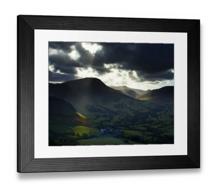 Framed Print : England, Cumbria, Lake District National Park. A shaft of light breaks through storm clouds above the north Framed Print : England, Cumbria, Lake District National Park. A shaft of light breaks through storm clouds above the north