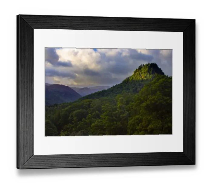 Framed Print : ENGLAND, Cumbria, Lake District National Park. A brief shaft of light illuminates Castle Crag