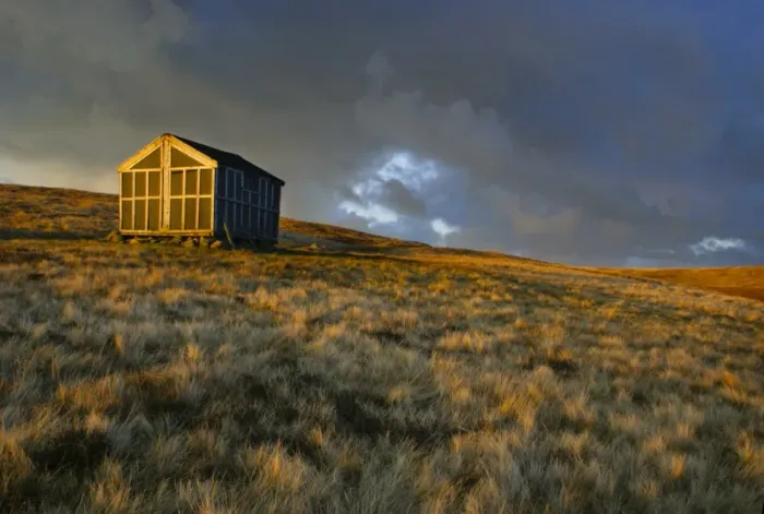 Framed Print : ENGLAND, Cumbria, Lake District National Park. The setting sun illuminates Lingy Hut