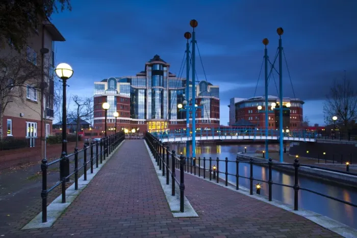 Framed Print : England, Greater Manchester, Salford Quays. Victoria Harbour building beyond Mariners Canal footbridge on the Manchester Ship Canal located
