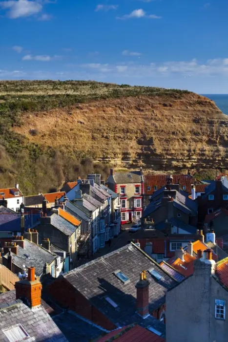 Framed Print : England, North Yorkshire, Staithes. View looking down on the roofs and chimney pots of the old town of Staithes, located within the North York Moors