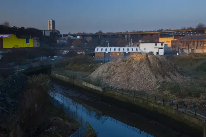 Framed Print : England, Tyne and Wear, Newcastle Upon Tyne. The Ouseburn running through a disappearing industrial landscape. The 800 metre long Byker Viaduct can be seen in