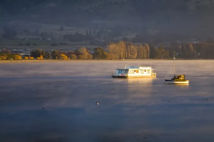 Framed Print : New Zealand, Otago, Lake Wanaka. The warm hues of sunset highlight the rising mist engulfing boats anchored on Framed Print : New Zealand, Otago, Lake Wanaka. The warm hues of sunset highlight the rising mist engulfing boats anchored on