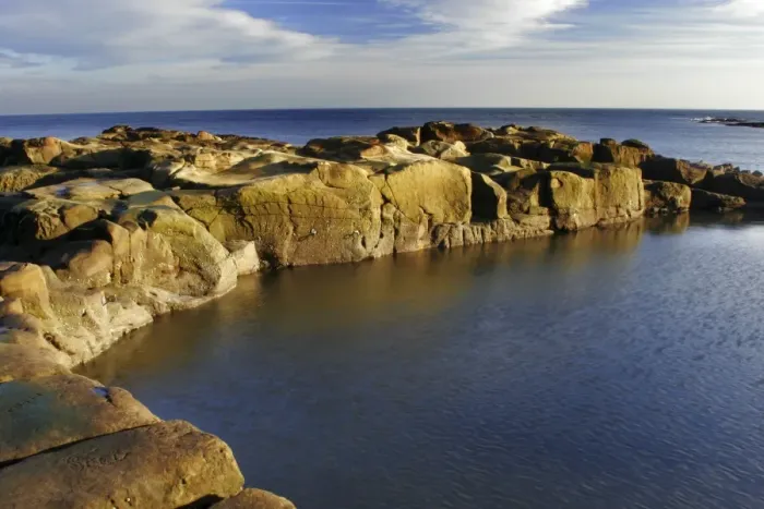 Framed Print : A swimming and bathing pool cut into the rocky coastline of the North Sea in North Tyneside