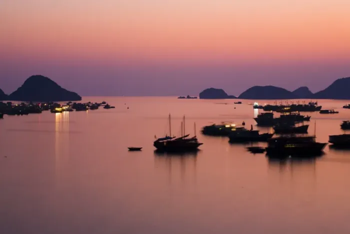 Framed Print : Vietnam, Northern Vietnam, Halong Bay. The pink sunset afterglow at dusk over Cat Ba harbour on Cat Ba