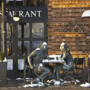 Metal figures outside a quayside restaurant print