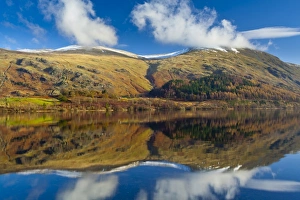 England, Cumbria, Lake District National Park. Lakeland hills reflected upon the still face of the Thirlmere
