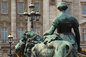 England, Greater London, City of Westminster. Bronze statue on the Victoria Memorial in Queens Garden, looking towards Buckingham Palace in