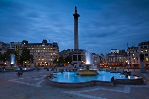 England, Greater London, City of Westminster. Nelsons Column and nearby fountains in Trafalgar Square, a popular tourist destination in London, photographed
