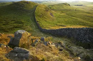Unesco Prints: ENGLAND Northumberland Hadrians Wall Sunset behind the world heritage site of Hadrians Wall near the town of