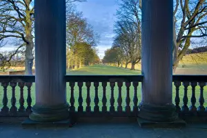 England, Tyne and Wear, Gibside. Looking through the stone pillars of the Gibside Chapel towards the half mile, Oak tree lined walk heading to the Column
