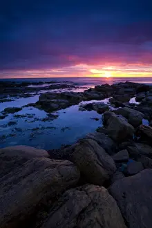 England, Tyne and Wear, Tynemouth. Sunrise over King Edwards Bay viewed from near Sharpness Point