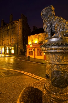 Scotland, Edinburgh, Greyfriars Bobby. Greyfriars Bobby, the famous loyal Skye Terrier who lay on the grave of his master John Gray for 14 years after his death in 1858 - Only leaving his grave briefly to