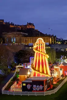 Scotland, Edinburgh, Princes Street Christmas Market. A traditional European Christmas Market located along Princes Street with the Scottish National Gallery and Edinburgh Castle in view