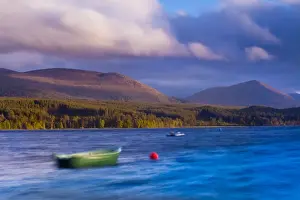 Scotland, Scottish Highlands, Cairngorms National Park. A stormy evening on Loch Morlich with the Cairngorm Moutain Range in
